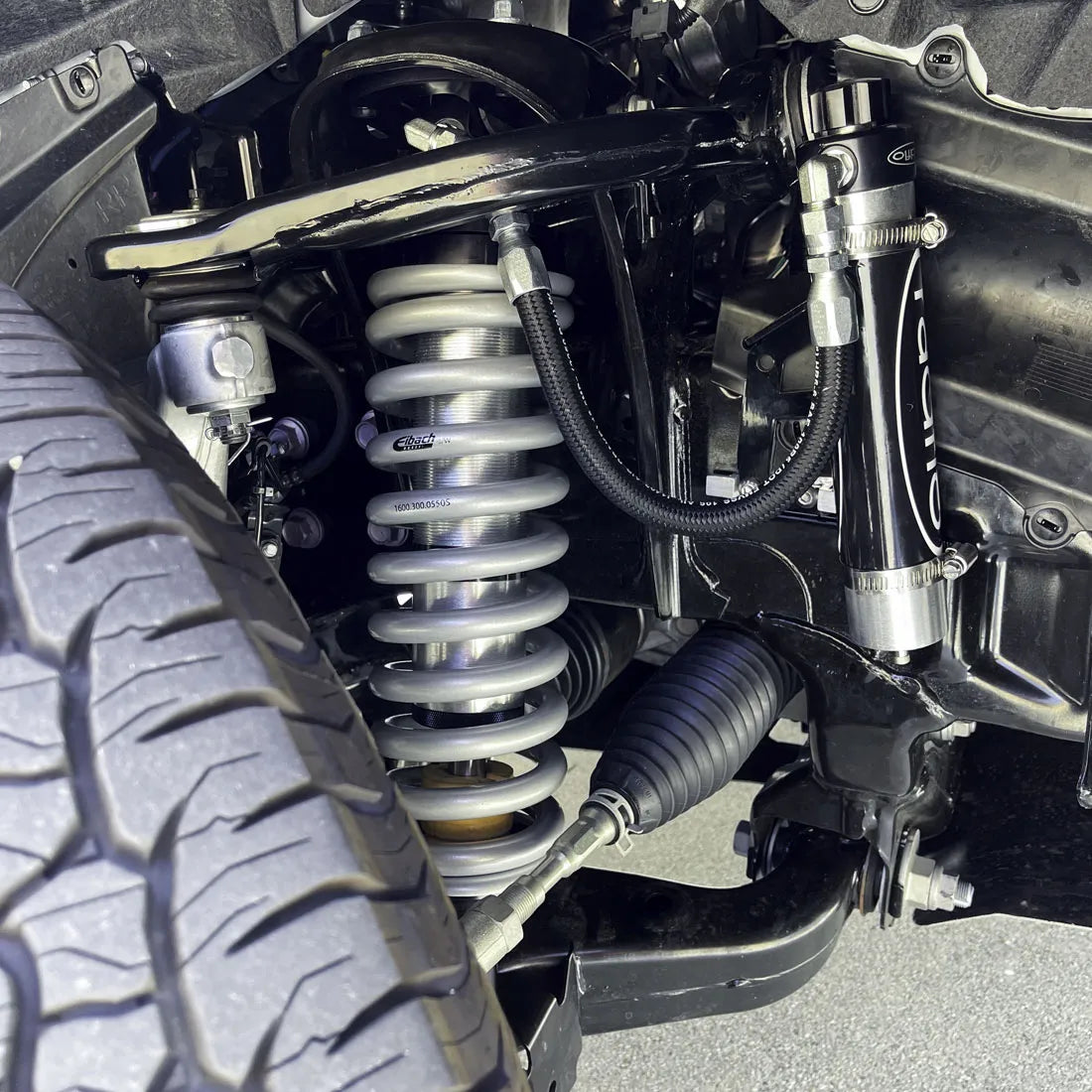 OE REPLACEMENT 2.5 FRONT COILOVER KIT TACOMA 2024+ WITH REMOTE RESERVOIR 2″ LIFT